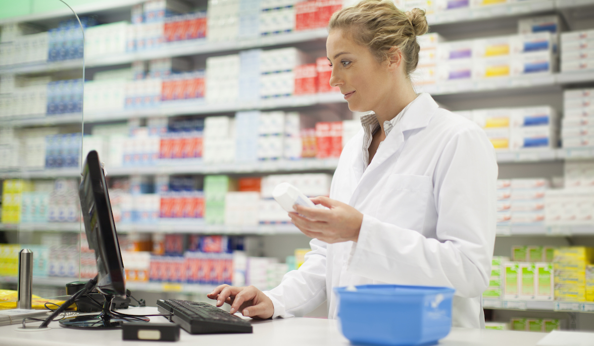 Pharmacist using a pharmacy automation system. 